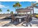 Outdoor community space featuring a fire pit and lounge chairs near the pool at 13805 Posada St, Venice, FL 34293