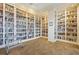 Well-stocked library with floor-to-ceiling bookshelves and reading area at 13805 Posada St, Venice, FL 34293