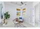 Bright office features a stylish rug, modern desk, chair, and a door at 13805 Posada St, Venice, FL 34293