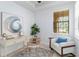 An airy office with a modern desk, chair, and a large window with a view at 13805 Posada St, Venice, FL 34293