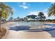 Large resort-style swimming pool with lounge chairs and umbrellas, perfect for relaxation at 13805 Posada St, Venice, FL 34293