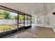 View of back porch with screened-in pool and white privacy fence at 1400 62Nd S Pl, St Petersburg, FL 33705