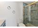 Updated bathroom features a glass shower door and blue marble-inspired tile at 1400 62Nd S Pl, St Petersburg, FL 33705