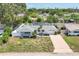 Inviting single-story home with an attached garage, surrounded by lush greenery at 1400 62Nd S Pl, St Petersburg, FL 33705