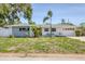 Well-kept home showcasing clean lines, lush lawn, and ample parking in a quiet neighborhood setting at 1400 62Nd S Pl, St Petersburg, FL 33705
