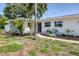 Beautiful home with a manicured lawn and a charming walkway leading to the entrance at 1400 62Nd S Pl, St Petersburg, FL 33705