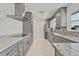 Spacious kitchen with stainless steel appliances, updated cabinetry and bright recessed lighting at 1400 62Nd S Pl, St Petersburg, FL 33705