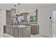 Bright kitchen showcasing stainless steel appliances, a center island and pendant lighting at 1400 62Nd S Pl, St Petersburg, FL 33705