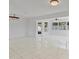 Bright and open living space with tile floors, white walls, and modern lighting at 1400 62Nd S Pl, St Petersburg, FL 33705