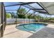The backyard features a large, in-ground pool with full screen enclosure at 1400 62Nd S Pl, St Petersburg, FL 33705