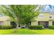 View of the backyard and patio with lush greenery and mature trees providing shade at 1426 Harbour Blue St, Ruskin, FL 33570