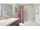 Well-lit bathroom with a shower-tub combo, vanity, and neutral color scheme at 1426 Harbour Blue St, Ruskin, FL 33570
