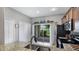 Bright kitchen features stainless steel appliances and granite countertops overlooking the outdoor patio at 1426 Harbour Blue St, Ruskin, FL 33570