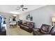 Cozy living room featuring a ceiling fan and views of the kitchen at 1426 Harbour Blue St, Ruskin, FL 33570