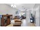 Well-lit living room area featuring a dining table and hardwood style floors at 1426 Harbour Blue St, Ruskin, FL 33570