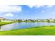 Picturesque pond surrounded by green lawns and well-maintained community homes at 1426 Harbour Blue St, Ruskin, FL 33570