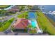 Community aerial view of clubhouse, pool, tennis court, and docks showcasing luxurious waterfront lifestyle at 1512 3Rd Street E Cir, Palmetto, FL 34221