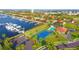 Aerial shot showcasing the marina, community pool, tennis court, and clubhouse in a coastal setting at 1512 3Rd Street E Cir, Palmetto, FL 34221