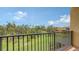 Private balcony view of lush green lawn and trees at 1512 3Rd Street E Cir, Palmetto, FL 34221