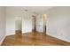 Large bedroom with beautiful flooring and three doorways providing access to other rooms in the house at 1512 3Rd Street E Cir, Palmetto, FL 34221