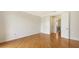 A bright bedroom features hardwood floors and connecting doors, offering space and easy access at 1512 3Rd Street E Cir, Palmetto, FL 34221