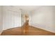 A light-filled bedroom features hardwood floors and a large closet, perfect for an organized space at 1512 3Rd Street E Cir, Palmetto, FL 34221