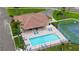 Beautiful pool and sun deck area with lounge chairs; near tennis courts and with shady covered area at 1512 3Rd Street E Cir, Palmetto, FL 34221
