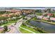 Inviting gated community entrance with lush landscaping, water feature, and roundabout street design at 1512 3Rd Street E Cir, Palmetto, FL 34221