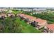 Beautiful yellow condos with screened-in patios and balconies overlooking a large grassy lawn area at 1512 3Rd Street E Cir, Palmetto, FL 34221