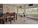 Light filled fitness center featuring dark wooden tables and chairs and rowing machine at 1512 3Rd Street E Cir, Palmetto, FL 34221