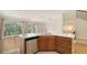 Bright kitchen boasts stainless steel dishwasher and ample counter space at 1512 3Rd Street E Cir, Palmetto, FL 34221