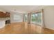 Spacious living area with wood floors, balcony doors, and neutral walls at 1512 3Rd Street E Cir, Palmetto, FL 34221