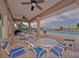 Outdoor patio with ample seating perfect for gatherings by the pool with scenic waterfront views at 1512 3Rd Street E Cir, Palmetto, FL 34221