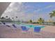 Relaxing poolside with lounge chairs overlooking the water offering a perfect spot for relaxation at 1512 3Rd Street E Cir, Palmetto, FL 34221