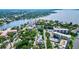Scenic aerial view of the city with lush green trees, waterfront views, and a clear blue sky at 1523 1St W Ave, Bradenton, FL 34205