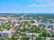 Scenic aerial view of the city with lush green trees, sparkling lakes, and a clear blue sky at 1523 1St W Ave, Bradenton, FL 34205