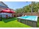 Backyard with swim spa, lounge chairs, and fire pit, perfect for relaxation and outdoor enjoyment at 1523 1St W Ave, Bradenton, FL 34205
