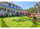 Backyard featuring putting green, deck, and ample seating at 1523 1St W Ave, Bradenton, FL 34205