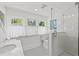 Modern bathroom with a glass shower, sleek fixtures, and ample natural light at 1523 1St W Ave, Bradenton, FL 34205