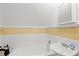 Classic bathroom with tiled walls, bathtub, and vanity at 1523 1St W Ave, Bradenton, FL 34205