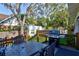 Backyard deck with barbecue grill, dining table set, and backyard putting green, ideal for outdoor entertainment at 1523 1St W Ave, Bradenton, FL 34205