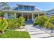 Charming two-story home with landscaped yard and inviting front porch at 1523 1St W Ave, Bradenton, FL 34205