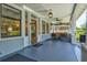 Cozy front porch with ample seating, perfect for relaxing outdoors at 1523 1St W Ave, Bradenton, FL 34205
