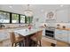 Bright kitchen features stainless steel appliances, custom white cabinets, and butcher block countertops at 1523 1St W Ave, Bradenton, FL 34205