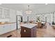 Beautiful kitchen with dining area, stainless steel fridge, and island with seating at 1523 1St W Ave, Bradenton, FL 34205