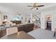 Spacious living room with ceiling fans, staircase, and hardwood floors throughout at 1523 1St W Ave, Bradenton, FL 34205