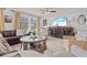 Cozy living room with large TV, perfect for relaxing and entertaining guests at 1523 1St W Ave, Bradenton, FL 34205