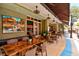 Inviting outdoor restaurant seating with shaded tables and a vibrant atmosphere at 1523 1St W Ave, Bradenton, FL 34205