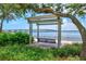 Picturesque outdoor swing seating area overlooking a beautiful body of water with scenic bridge views at 1523 1St W Ave, Bradenton, FL 34205