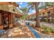Vibrant street view featuring a coffee shop with outdoor seating and a glimpse of local businesses at 1523 1St W Ave, Bradenton, FL 34205